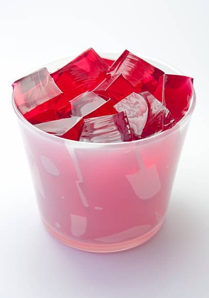 istock Red jelly in a white drinking glass 184143382