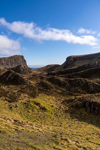 Mountain range in the Quiraing on the Isle of Skye, Scotland, on a sunny day of springtime.