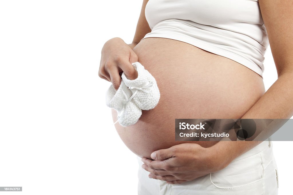 Prengant Frau Bauch mit kleinen Schuhen - Lizenzfrei Babyschuh Stock-Foto