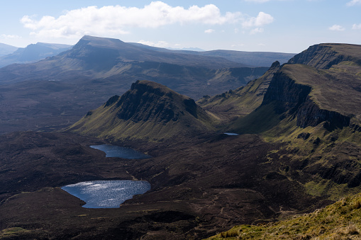Mountain range in the Quiraing on the Isle of Skye, Scotland, on a sunny day of springtime.
