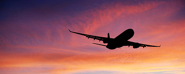 istock XL jet airplane taking off at sunset 184143915