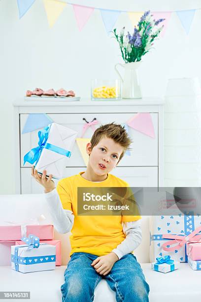 Cute Boy With Birthday Present Stock Photo - Download Image Now - 8-9 Years, Birthday, Birthday Present