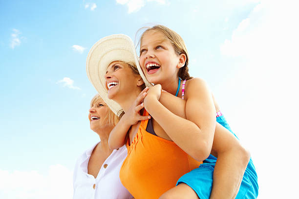 istock Girl enjoying a back ride on mother 184145431