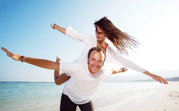 istock Happy young couple on the beach. 184145672