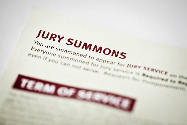 Jury Duty Summons macro of an actual jury duty summons. juror stock pictures, royalty-free photos & images