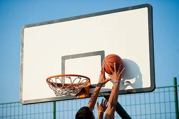 Rear view of young basketbal players in the action