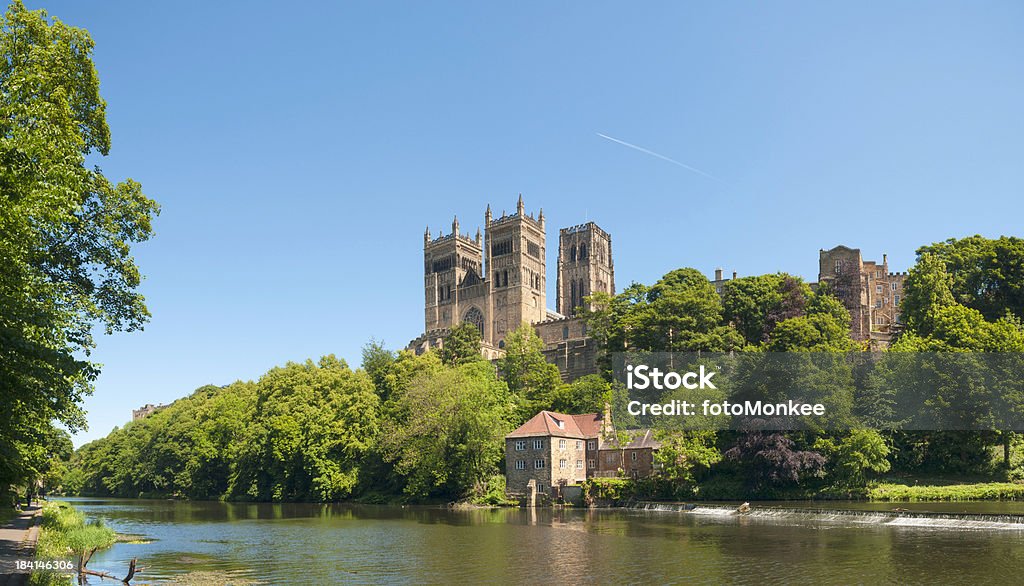 Durham Cathedral, Fulling Mill and River Wear, UK "Durham Cathedral is renowned as a masterpiece of Romanesque (or Norman) architecture. It was begun in 1093 and largely completed within 40 years. The Cathedral is built on a strategic peninsula of land created by a loop in the River Wear and its west end towers over a precipitous gorge. Together with its neighbour Durham Castle, the cathedral is now a World Heritage Site. The Old Fulling Mill next to a weir on the river, dates mostly from the 15th Century and played a key part of Durham's cloth-making industry. Image taken late on a bright summers day with plenty of space for copy and text. ProPhoto RGB profile for maximum color fidelity and gamut.More of my images from around Britain in this lightbox:" Durham Cathedral Stock Photo