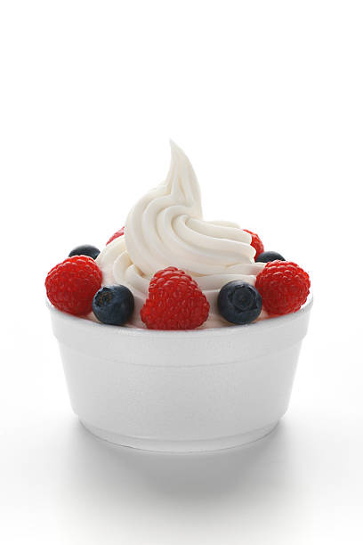 Frozen Yogurt with Berries Single serving of frozen yogurt (or soft serve ice cream) with raspberries and blueberries in a standard disposable restaurant portion cup. frozen yoghurt stock pictures, royalty-free photos & images