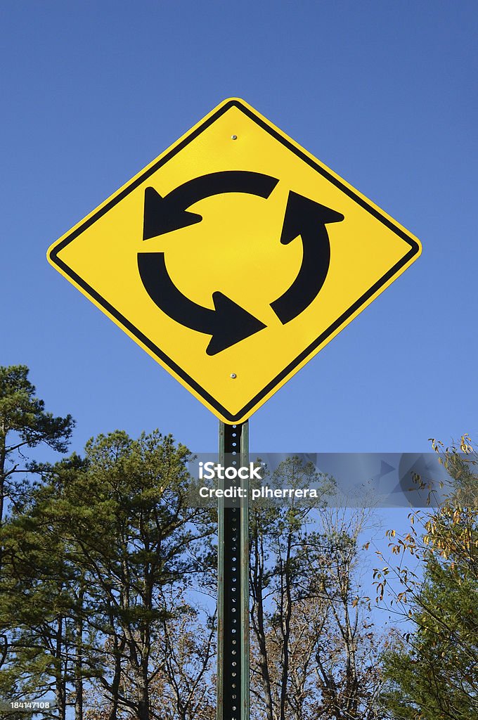 Yellow Traffic Circle Sign Yellow traffic circle sign Arrow Symbol Stock Photo