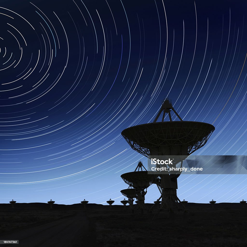 XXL radio telescopes silhouette large radio telescopes in silhouette at night with long exposure starry sky, square frame (XXL) Radio Telescope Stock Photo