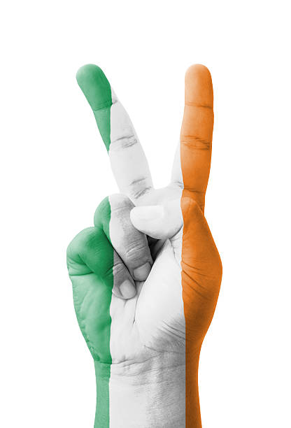 istock Hand making the V sign, Ireland flag painted 184147419
