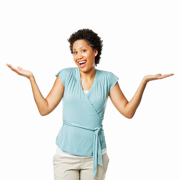 istock Attractive Woman Shrugging Her Shoulders - Isolated 184147524