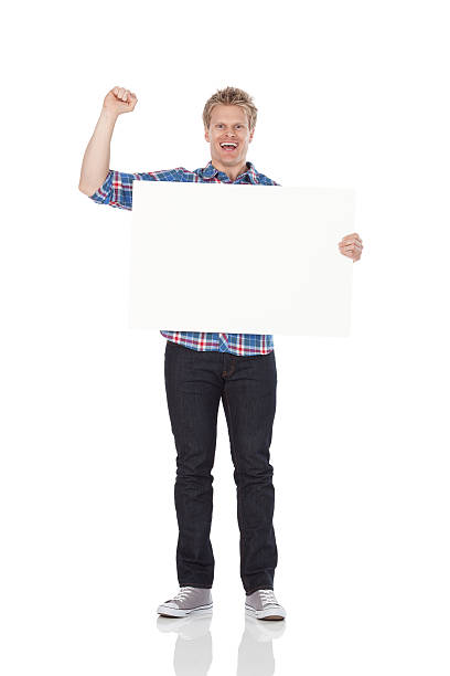 istock Man holding a placard and smiling 184147754