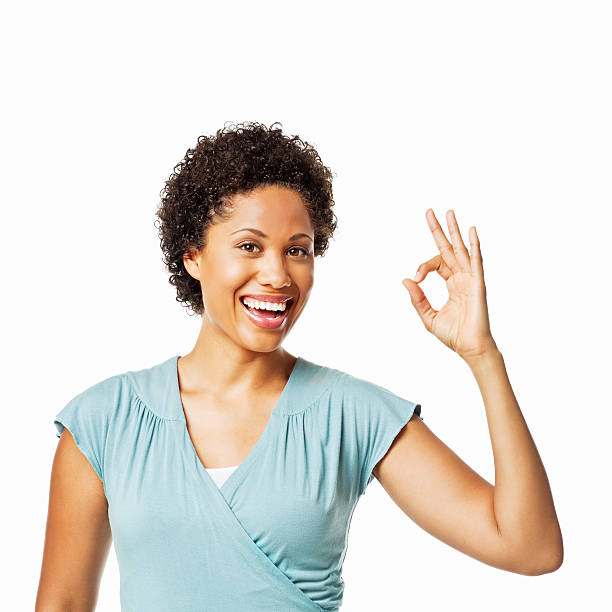 istock Beautiful Woman Gesturing an Okay Sign - Isolated 184147778