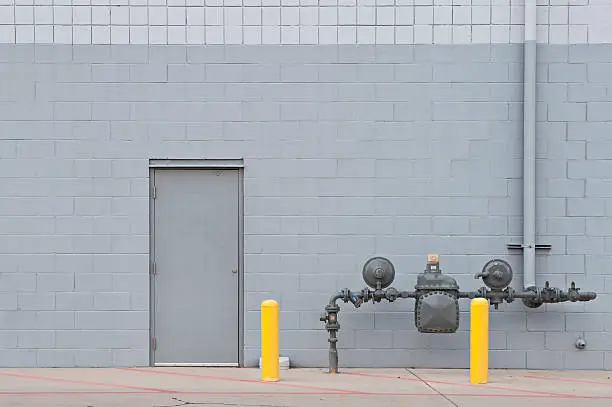 Photo of Industrial Utility Door on Brick Wall