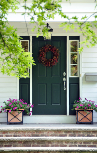 Front door with wreath and planters. FOR MORE HOUSES AND DOORS (CLICK