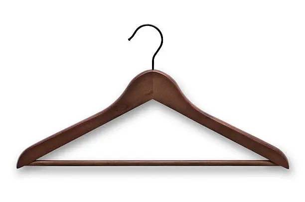 Clipping path included. Elegant, wooden, dark brown clothes hanger isolated on white background.