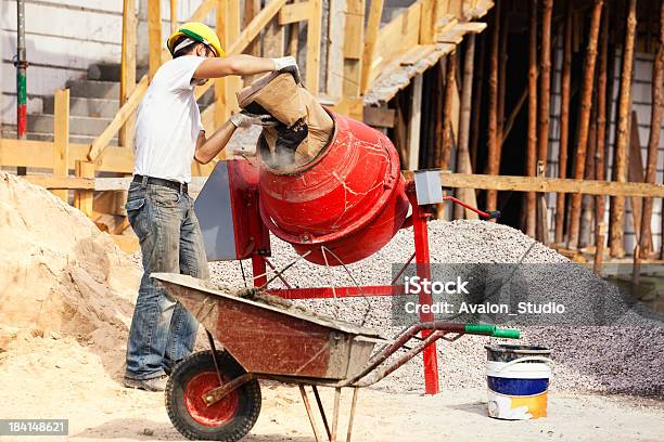 Bricklayer And Concrete Mixer Stock Photo - Download Image Now - Cement Mixer, Cement, Construction Site