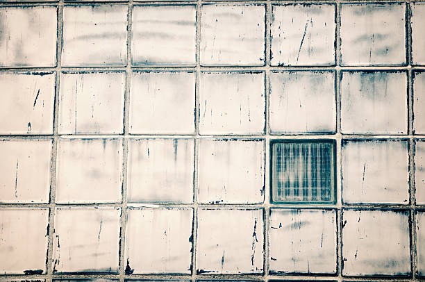 istock Grunge Glass Block Window With One Square Different 184148807