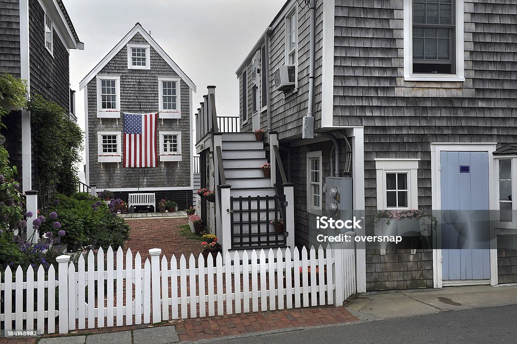 Provincetown flag "Beautiful traditional homes and picket fences in Provincetown, MassachusettsCape Cod, USA" Provincetown Stock Photo