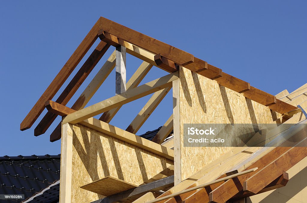 Roof construction Wooden dormer under construction. Architecture Stock Photo
