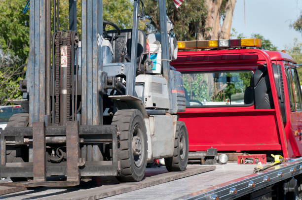 istock Forklift on a Flatbed Tow Truck 184150481