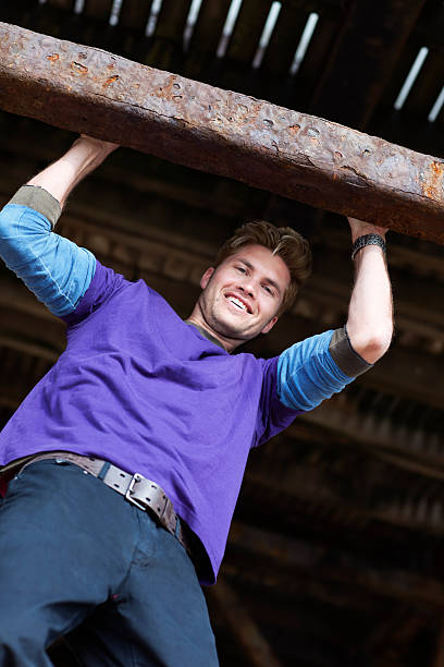 istock Young Man Hanging From a Pier 184151172