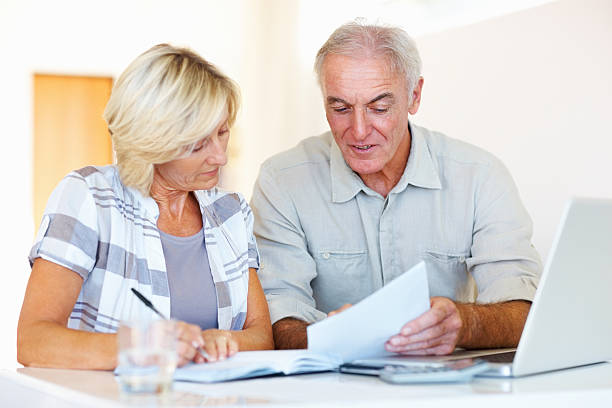 istock Senior couple noting their monthly expenses 184151667