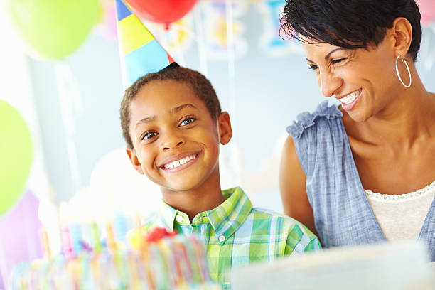 istock Happy mother while celebrating her son's birthday 184151942