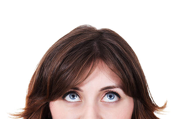 istock A brown haired woman looking up on a white background 184153308