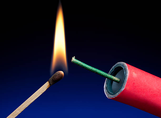 istock Fireworks or TNT; Lit Match About To Light Fuse 184153551