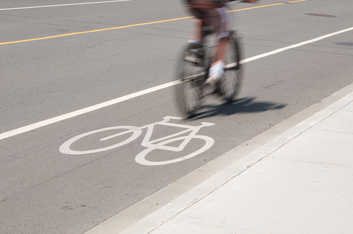 Cyclist in Motion in Bike Lane. Victoria, B.C.