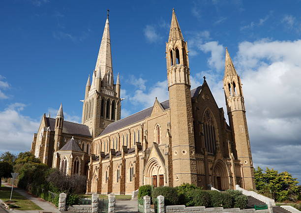 Beige stone cathedral against the blue sky Sacred Heart Cathedral in Bendigo, Victoria, Australia bendigo photos stock pictures, royalty-free photos & images