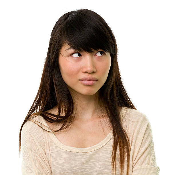istock Uncertain Young Woman Looks Away 184154121