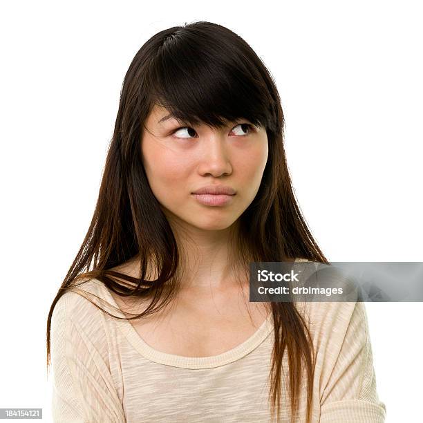 Uncertain Young Woman Looks Away Stock Photo - Download Image Now - Asian and Indian Ethnicities, Boredom, Women