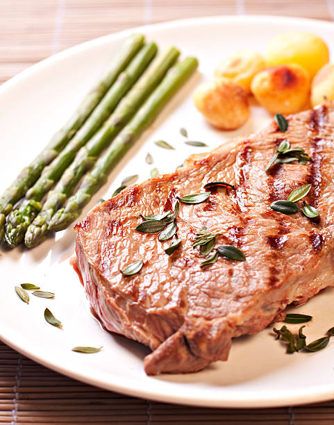 istock Steak with asparagus and potateos 184154482
