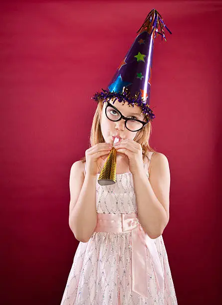 Photo of 1950's retro party pooper upset little birthday girl