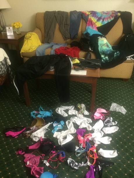 istock Laundry All Over the Floor in a Hotel Room 1841545751