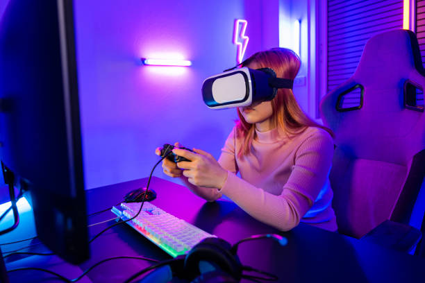 istock Gamer in VR headset glasses exploring metaverse play video game online with joystick 1841597316