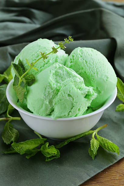 balls mint ice cream with fresh green herb