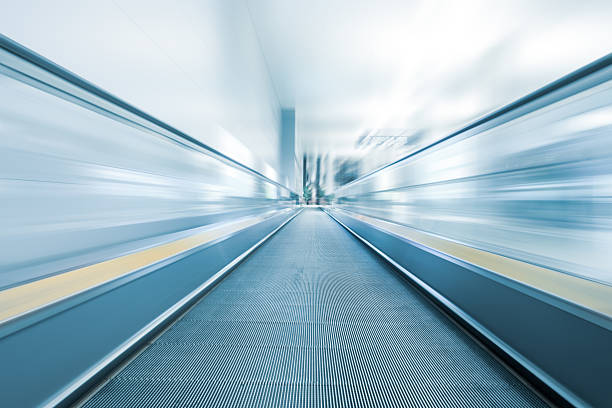 istock Moving  modern escalator at a international airport 184171181