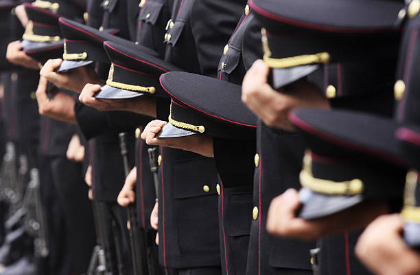 istock Soldiers standing in line and holding their hats 184171767