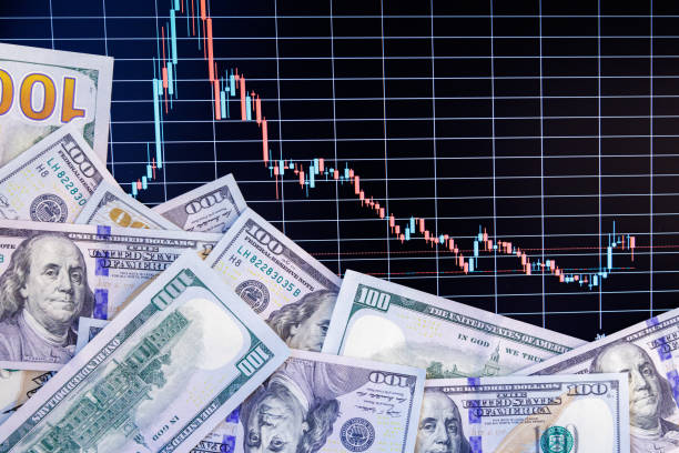 istock US dollar banknotes over digital screen with exchange chart, depreciation and volatility concept 1841717952