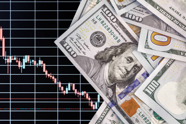 istock US dollar banknotes over digital screen with exchange chart, depreciation and volatility concept 1841718475