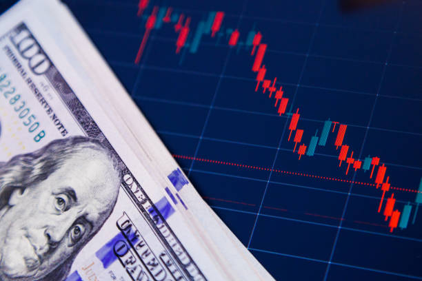 istock US dollar banknotes over digital screen with exchange chart, depreciation and volatility concept 1841718993