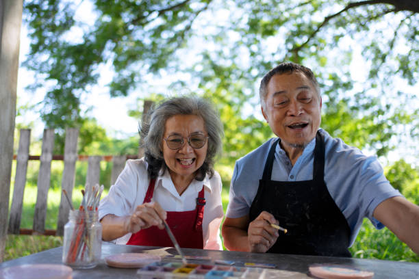 istock Senior couple learn how to make pottery. 1841727812