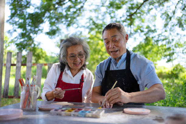 istock Senior couple learn how to make pottery. 1841727818