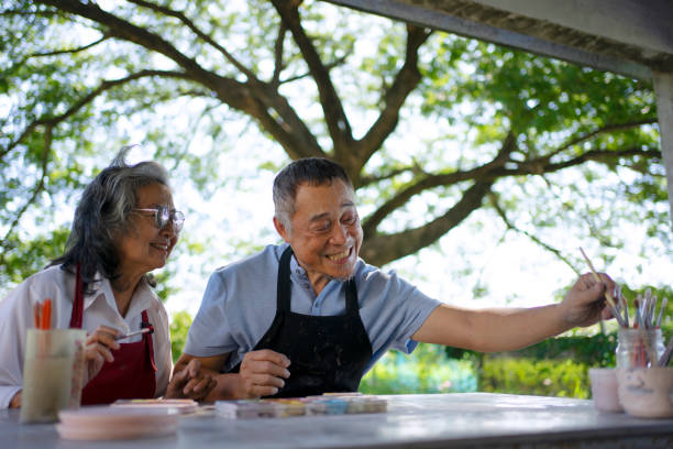 istock Senior couple learn how to make pottery. 1841727829