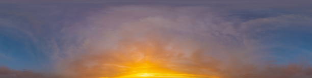 istock Golden glowing sunset sky panorama with Cirrus clouds. Hdr seamless spherical equirectangular 360 panorama. Sky dome or zenith for 3D visualization and sky replacement for aerial drone 360 panoramas. 1841764952