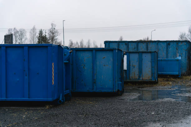 Group of large industrial waste containers Group of large industrial waste containers on gravel large dumpster stock pictures, royalty-free photos & images